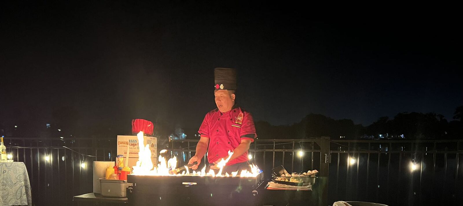 Happy Hibachi chef flame show at a hibachi catering party at home on Long Island