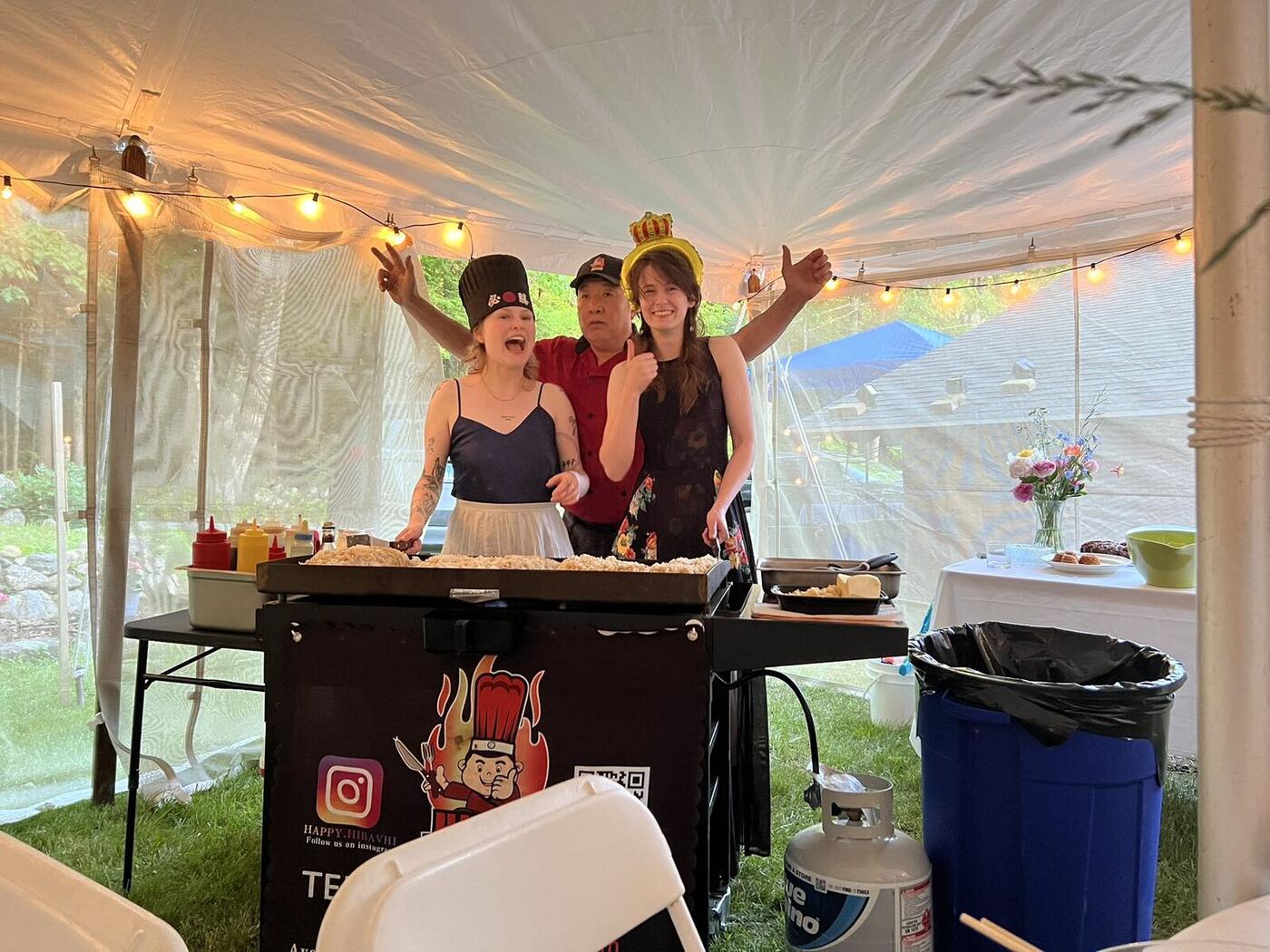 Hibachi party under a tent in a Long Island backyard